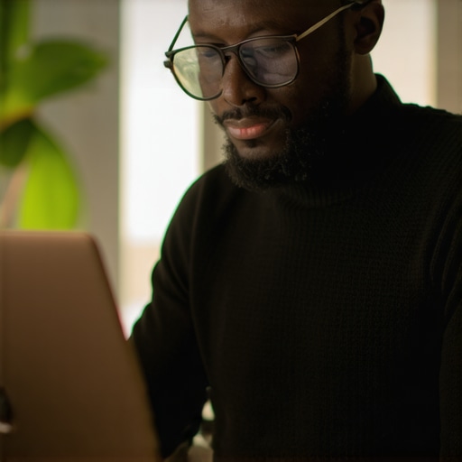 Business owner optimizing Google profile on laptop.